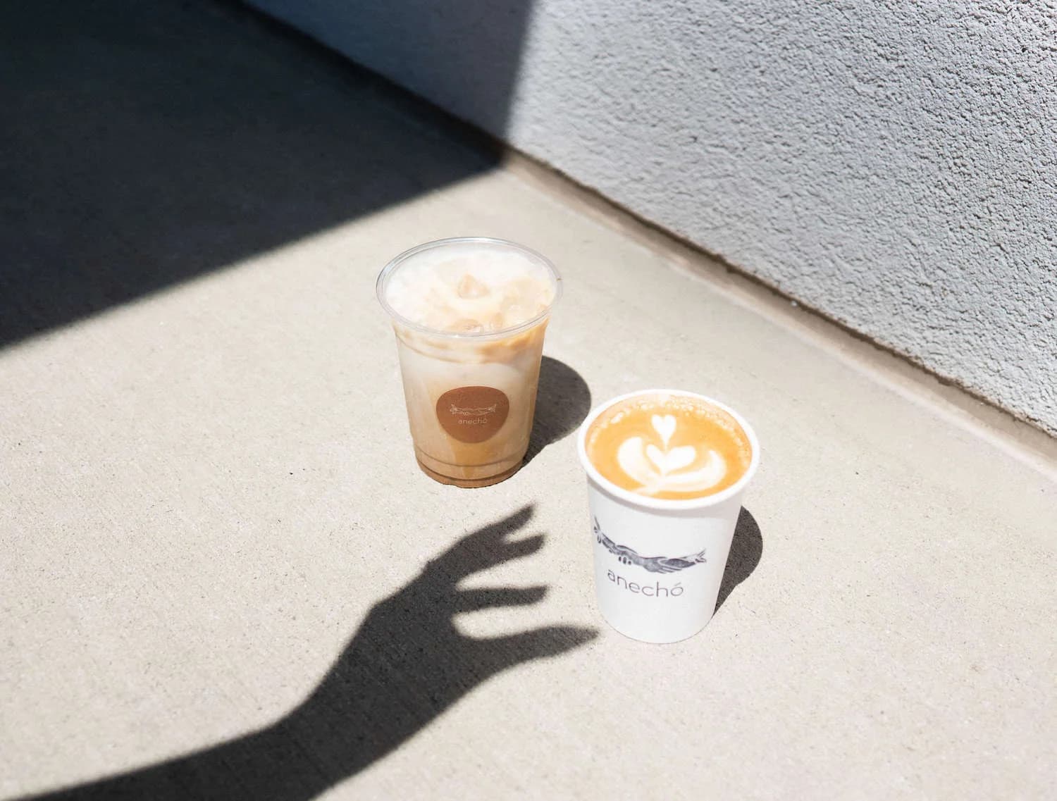 Hot and iced coffees in Anechó branded cups served at a customer appreciation event