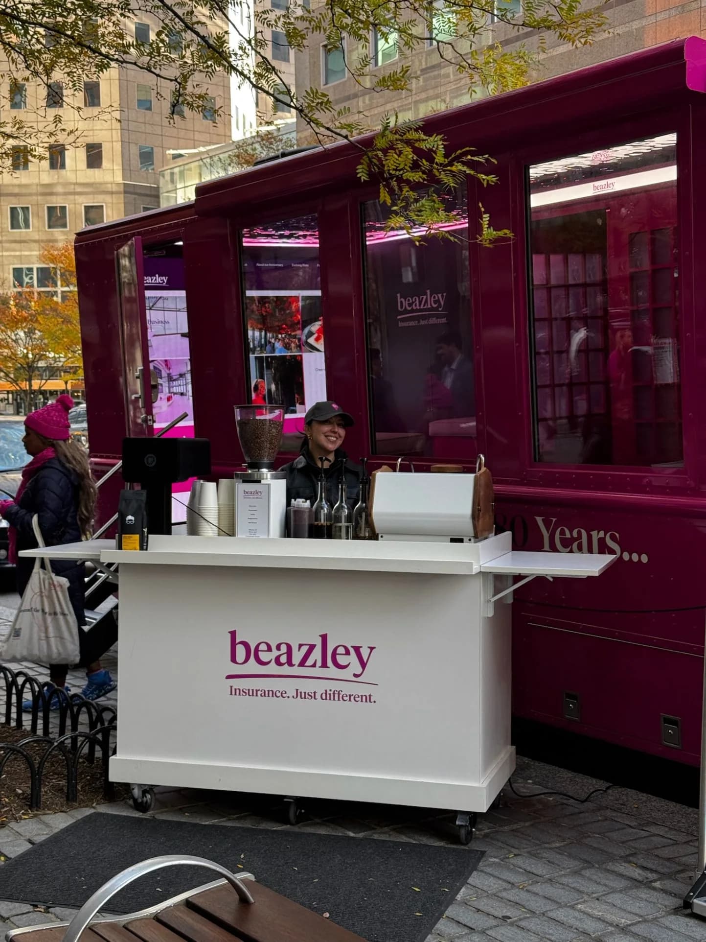 Anechó barista serving from a branded coffee cart at a corporate client event