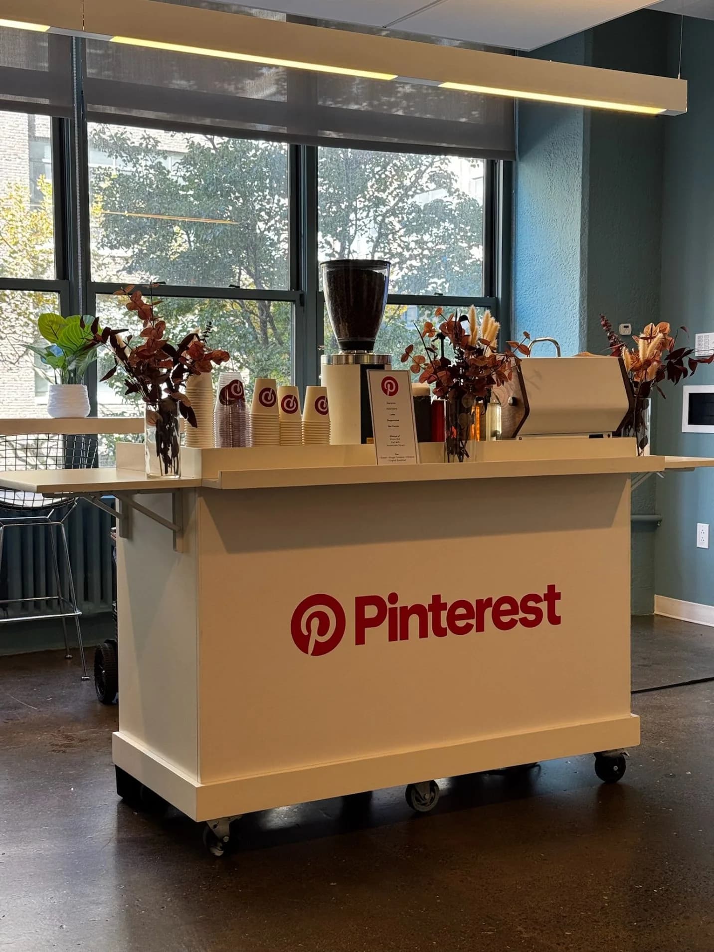 Guests gathered around a branded coffee cart at a Pinterest brand activation